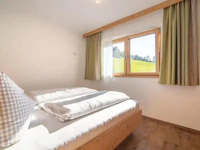 Ein Bett oder Betten in einem Zimmer der Unterkunft Blasinghof
