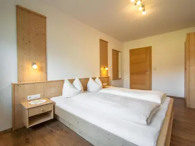 Ein Bett oder Betten in einem Zimmer der Unterkunft Blasinghof I