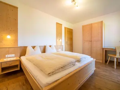 Ein Bett oder Betten in einem Zimmer der Unterkunft Blasinghof I