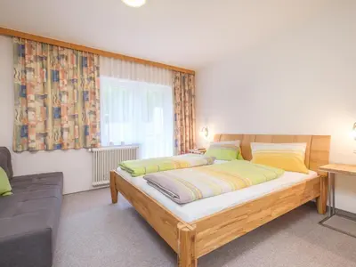Ein Bett oder Betten in einem Zimmer der Unterkunft Rupertihof II