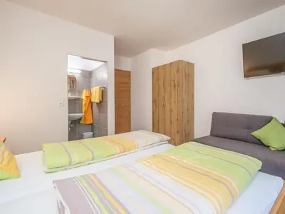 Ein Bett oder Betten in einem Zimmer der Unterkunft Rupertihof II