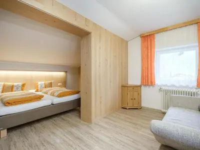 Ein Bett oder Betten in einem Zimmer der Unterkunft Rupertihof I