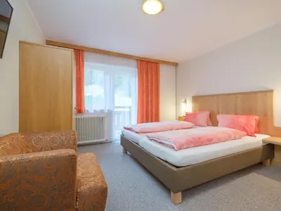 Ein Bett oder Betten in einem Zimmer der Unterkunft Rupertihof I