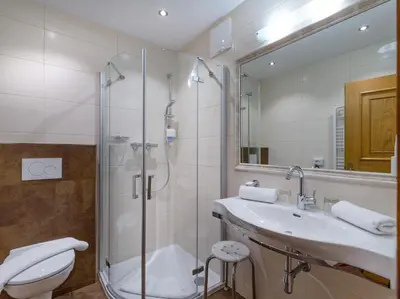 Ein Badezimmer in der Unterkunft Alpenherz Hotel Garni