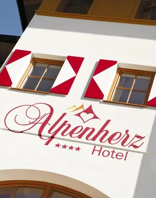 Ein Zertifikat, Auszeichnung, Logo oder anderes Dokument, das in der Unterkunft Alpenherz Hotel Garni ausgestellt ist