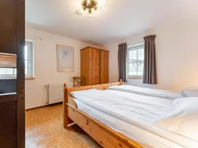 Ein Bett oder Betten in einem Zimmer der Unterkunft Kitzbüheler Alpen L