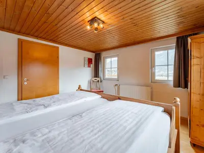 Ein Bett oder Betten in einem Zimmer der Unterkunft Kitzbüheler Alpen XL