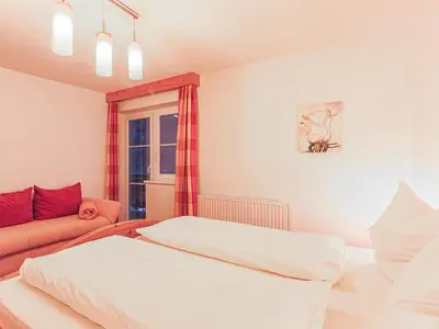Ein Bett oder Betten in einem Zimmer der Unterkunft Glonersbühelhof Top 3
