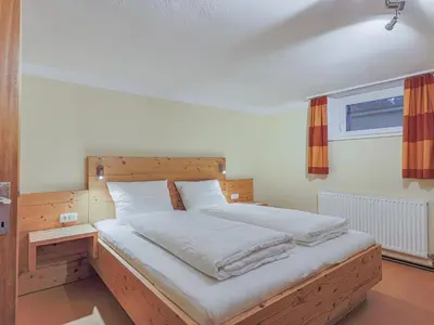 Ein Bett oder Betten in einem Zimmer der Unterkunft Glonersbühelhof Top 2