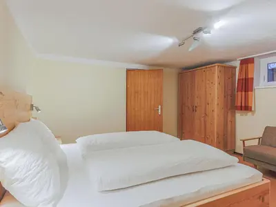 Ein Bett oder Betten in einem Zimmer der Unterkunft Glonersbühelhof Top 2