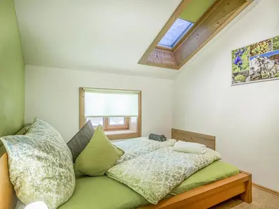 Ein Bett oder Betten in einem Zimmer der Unterkunft Troadstadl XL