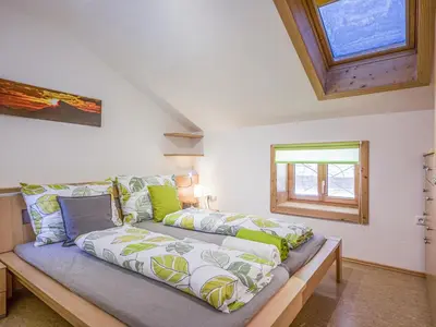 Ein Bett oder Betten in einem Zimmer der Unterkunft Troadstadl XL