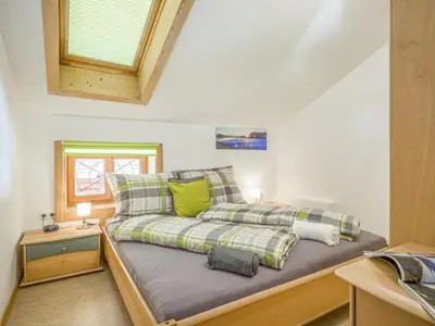 Ein Bett oder Betten in einem Zimmer der Unterkunft Troadstadl Windaublick