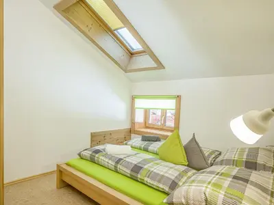 Ein Bett oder Betten in einem Zimmer der Unterkunft Troadstadl Windaublick