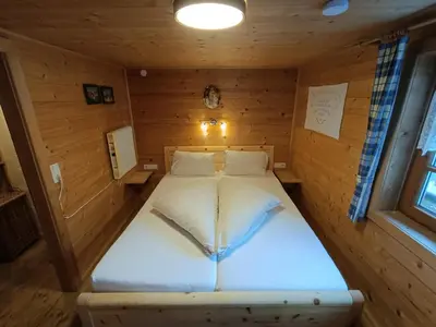 Ein Bett oder Betten in einem Zimmer der Unterkunft Urige Alm