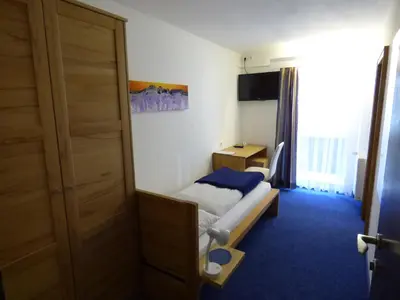 Ein Bett oder Betten in einem Zimmer der Unterkunft Panoramahotel