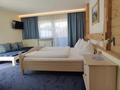 Ein Bett oder Betten in einem Zimmer der Unterkunft Panoramahotel