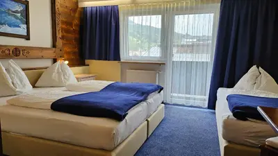 Ein Bett oder Betten in einem Zimmer der Unterkunft Panoramahotel