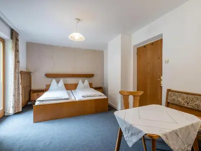 Ein Bett oder Betten in einem Zimmer der Unterkunft Gasteigerhof