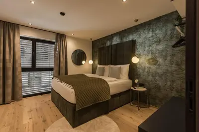 Ein Bett oder Betten in einem Zimmer der Unterkunft Grand Alpin Panorama Lodge Top 3
