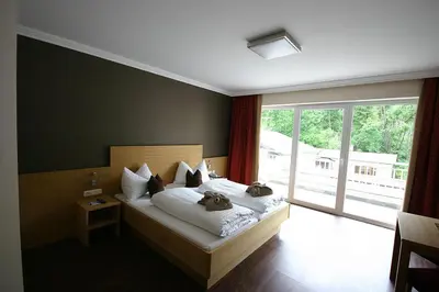 Ein Bett oder Betten in einem Zimmer der Unterkunft Hotel Herzblut - Joker card included in summer