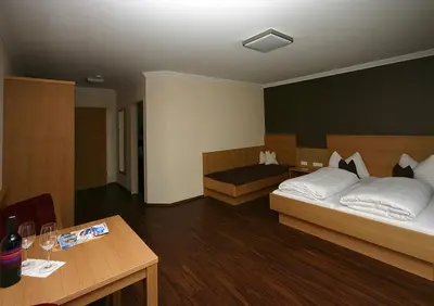 Ein Bett oder Betten in einem Zimmer der Unterkunft Hotel Herzblut - Joker card included in summer