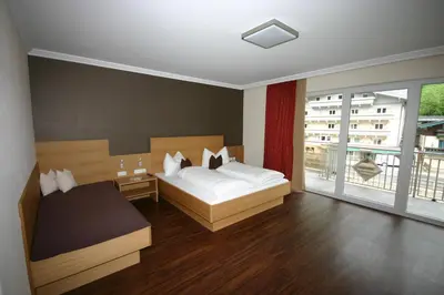 Ein Bett oder Betten in einem Zimmer der Unterkunft Hotel Herzblut - Joker card included in summer