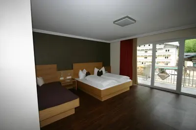 Ein Bett oder Betten in einem Zimmer der Unterkunft Hotel Herzblut - Joker card included in summer