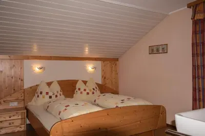 Ein Bett oder Betten in einem Zimmer der Unterkunft Ferienwohnung Prent Wildschönau WILD023 by FeWo-Plan