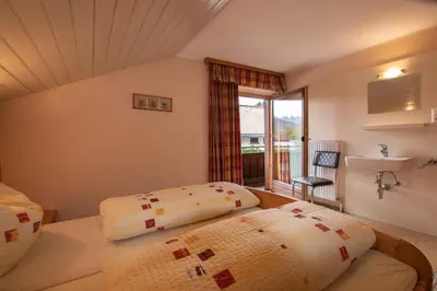 Ein Bett oder Betten in einem Zimmer der Unterkunft Ferienwohnung Prent Wildschönau WILD023 by FeWo-Plan