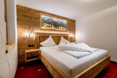 Ein Bett oder Betten in einem Zimmer der Unterkunft Hotel Restaurant Hexenalm