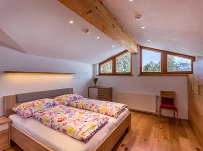 Ein Bett oder Betten in einem Zimmer der Unterkunft Wegrainhof