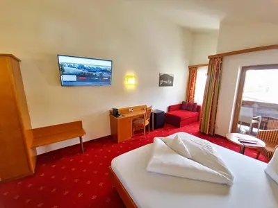 Ein Bett oder Betten in einem Zimmer der Unterkunft Das Alpin - Hotel Garni Guesthouse