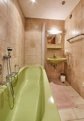 Ein Badezimmer in der Unterkunft Appartements Taxach