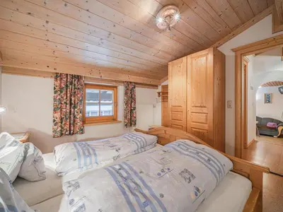 Ein Bett oder Betten in einem Zimmer der Unterkunft Weberhof Top 5