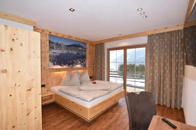 Ein Bett oder Betten in einem Zimmer der Unterkunft Krölls Alpenchalet