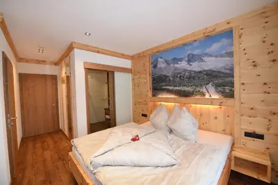 Ein Bett oder Betten in einem Zimmer der Unterkunft Krölls Alpenchalet
