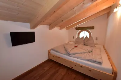 Ein Bett oder Betten in einem Zimmer der Unterkunft Krölls Alpenchalet