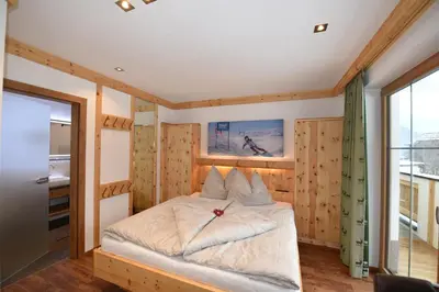 Ein Bett oder Betten in einem Zimmer der Unterkunft Krölls Alpenchalet