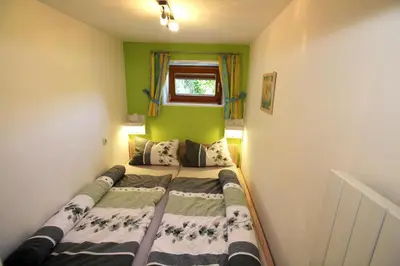 Ein Bett oder Betten in einem Zimmer der Unterkunft Ferienwohnung Schildwolf