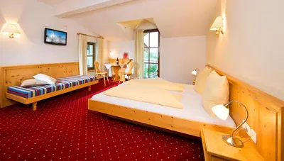 Ein Bett oder Betten in einem Zimmer der Unterkunft Hotel Reitlwirt