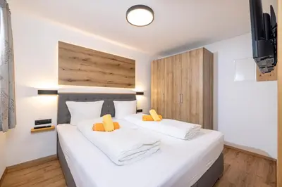 Ein Bett oder Betten in einem Zimmer der Unterkunft Apart Stiegler