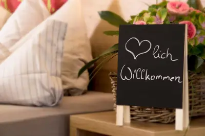 Ein Bett oder Betten in einem Zimmer der Unterkunft Hotel Post am See
