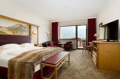 Ein Bett oder Betten in einem Zimmer der Unterkunft Hotel Post am See