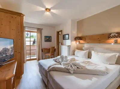 Ein Bett oder Betten in einem Zimmer der Unterkunft Landhaus Kitzhorn Appartement Hahnenkamm - by NV-Appartements
