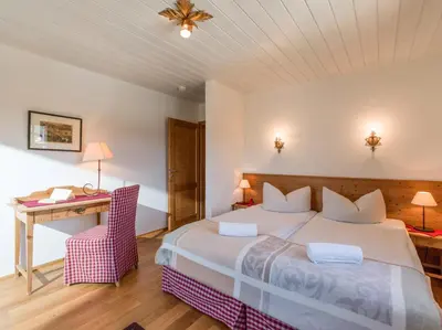 Ein Bett oder Betten in einem Zimmer der Unterkunft Landhaus Kitzhorn Appartement Hahnenkamm - by NV-Appartements