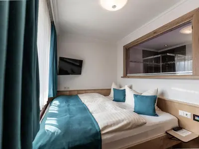 Ein Bett oder Betten in einem Zimmer der Unterkunft FRAU GANS - pure mountain apartments