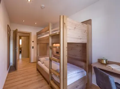 Ein Bett oder Betten in einem Zimmer der Unterkunft Isskogel Suites