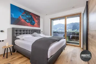 Ein Bett oder Betten in einem Zimmer der Unterkunft RANAPART - Panoramawohnung Sonnenseite Zillertal