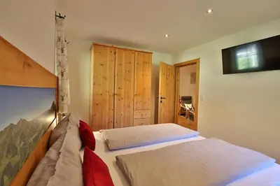 Ein Bett oder Betten in einem Zimmer der Unterkunft Alpboden